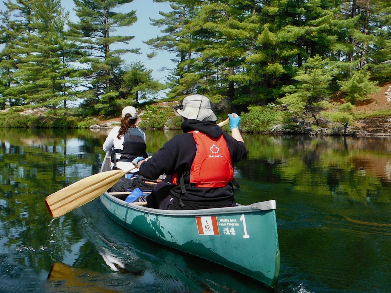 Canoe on a northern Ontario lake at sunrise